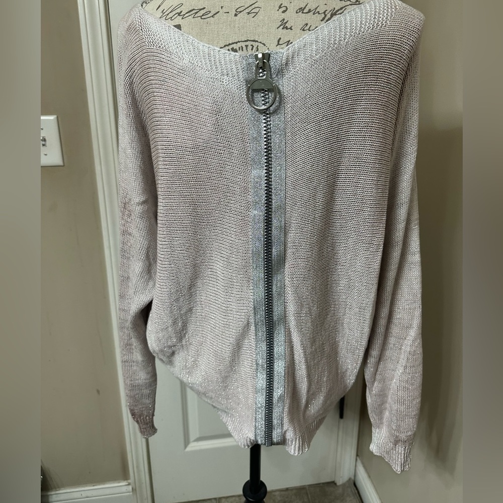 Boutique purchased light sweater. New with tags.